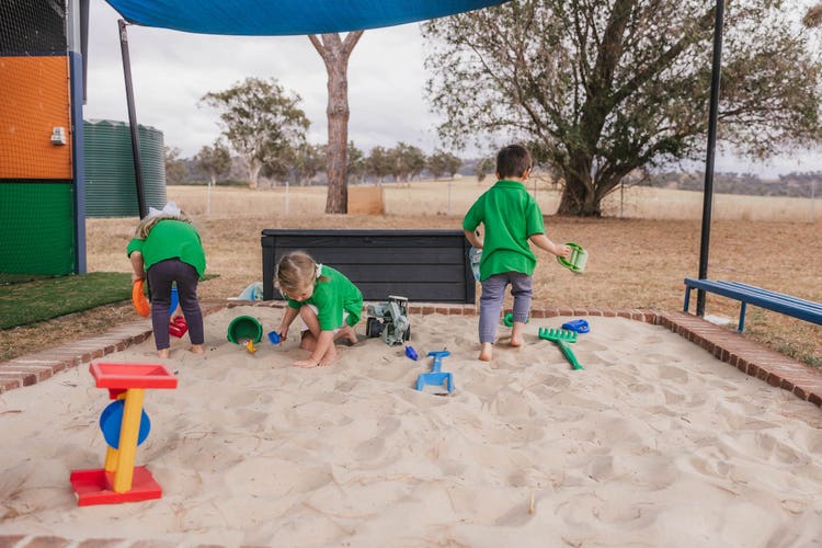 Image of children playing in a sandpit