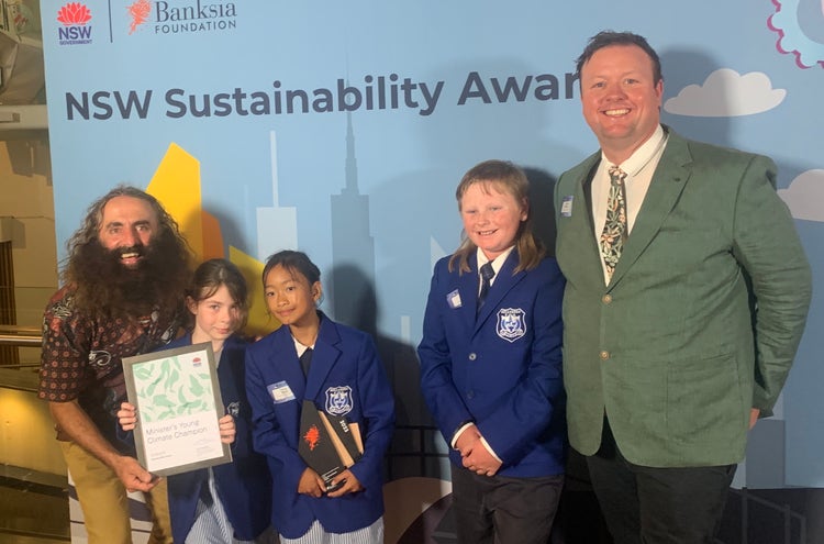 Photo of Costa Georgiadis and Belltrees students holding their award