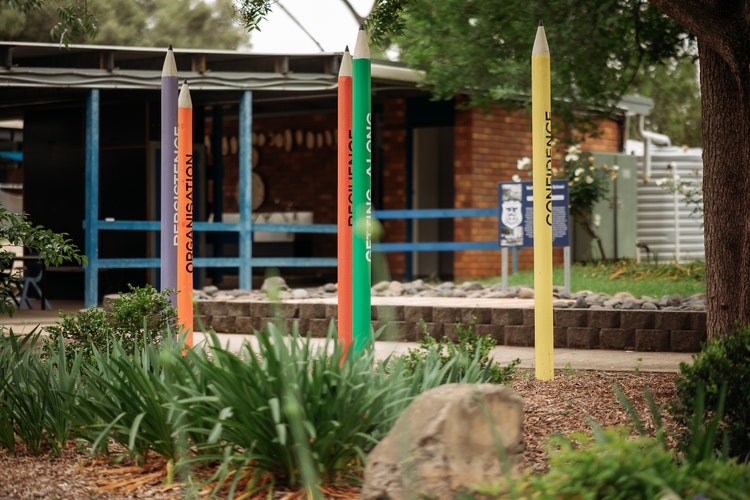 Image of art installation in front of a school building
